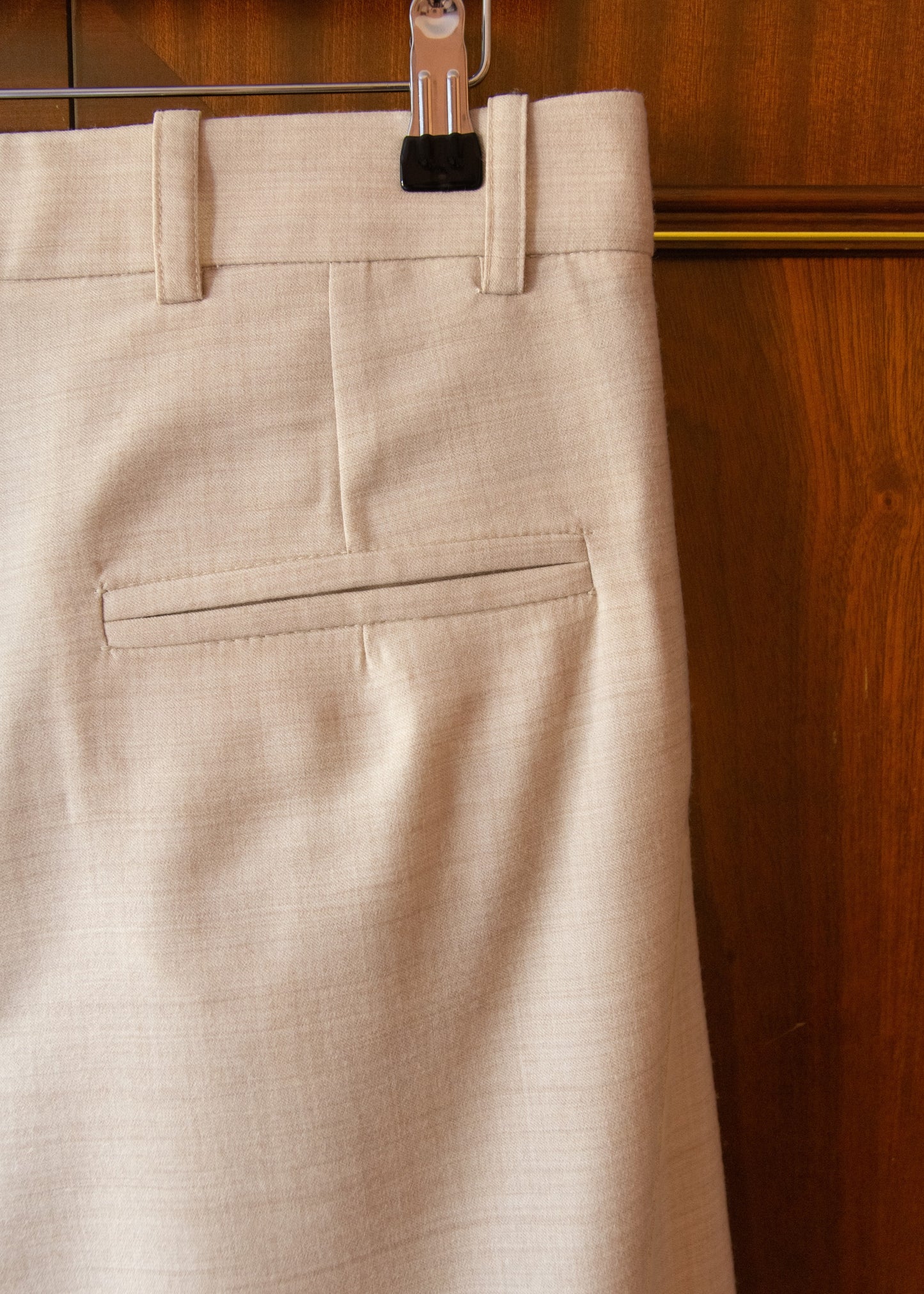PLEATED WOOL FLOCK TROUSERS IN CREAM