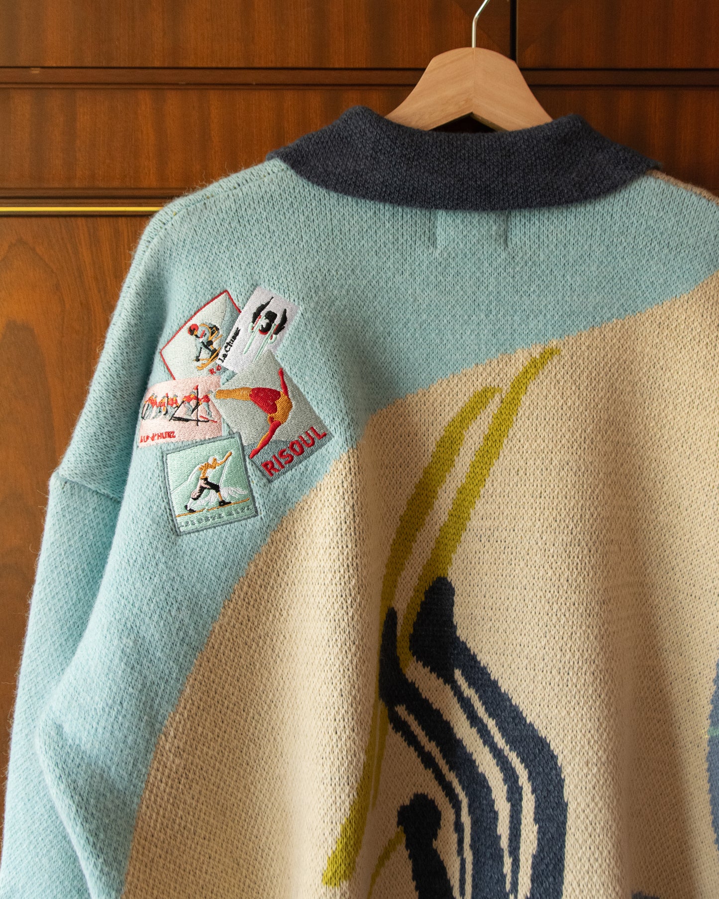 KNITTED SKI JUMPER WITH EMBROIDERED POSTCARDS