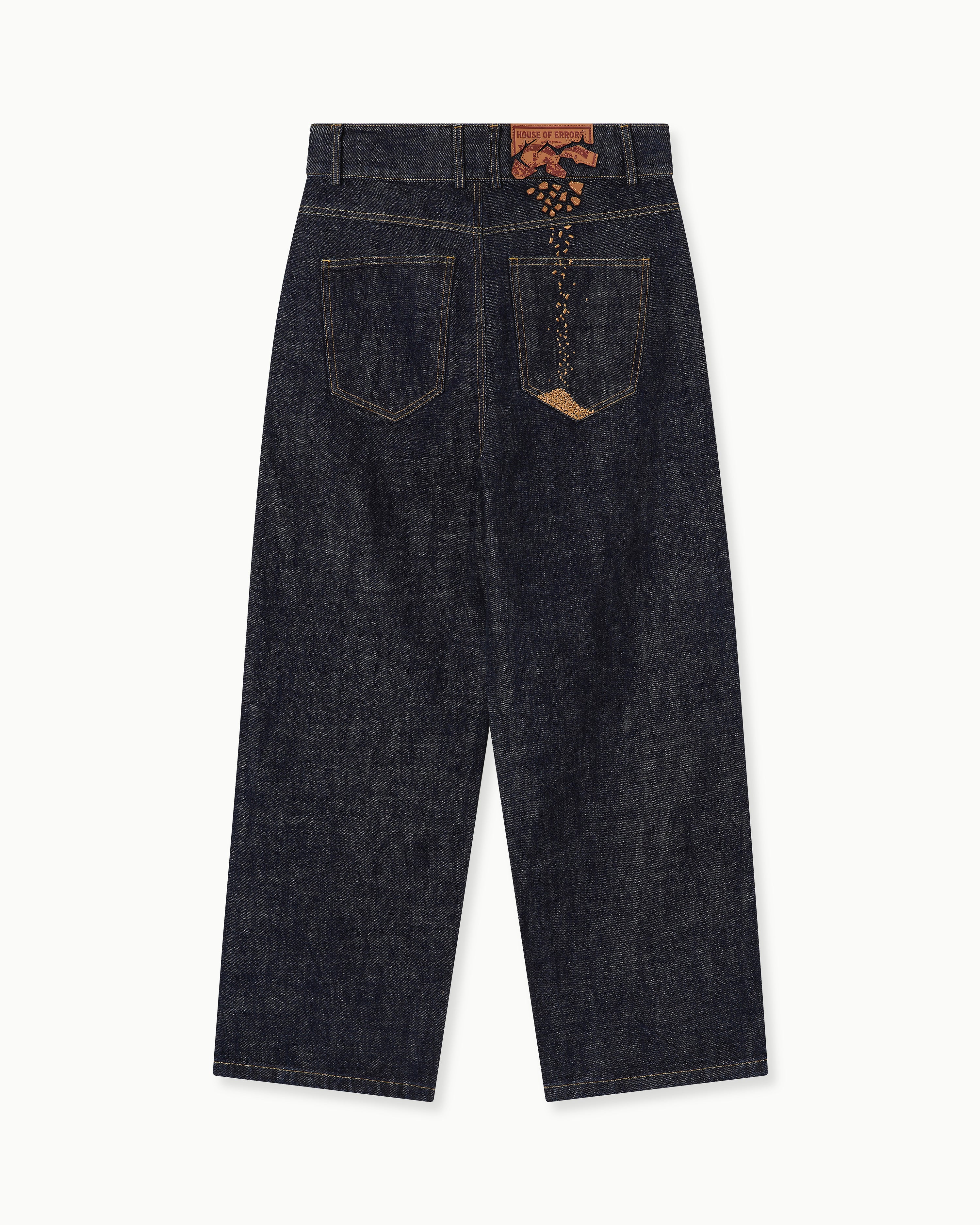 CRUMBLING PATCH JEANS